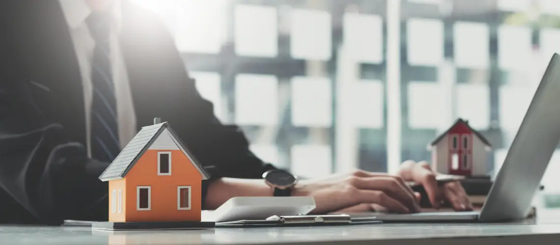 Property valuer assessing a suburban home for a formal valuation report